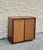 Mid-century walnut bar cabinet with a compact case and sliding top extension. Rectilinear form with two front doors inset...