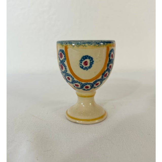 Delightful collection of four Henriot Quimper egg cups.