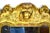 A french carved wood and gilt cherub acanthus wall mirror with a cherub head, encapsulated by fine carved floral. Either...