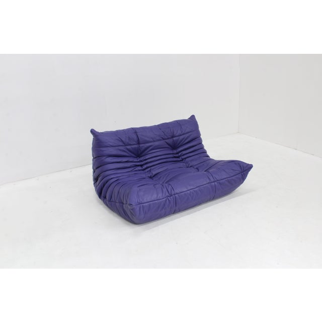 Vintage purple leather Togo 2 seater sofa by Ligne Roset designed by Michel Ducaroy. This is an original vintage 2 seater...