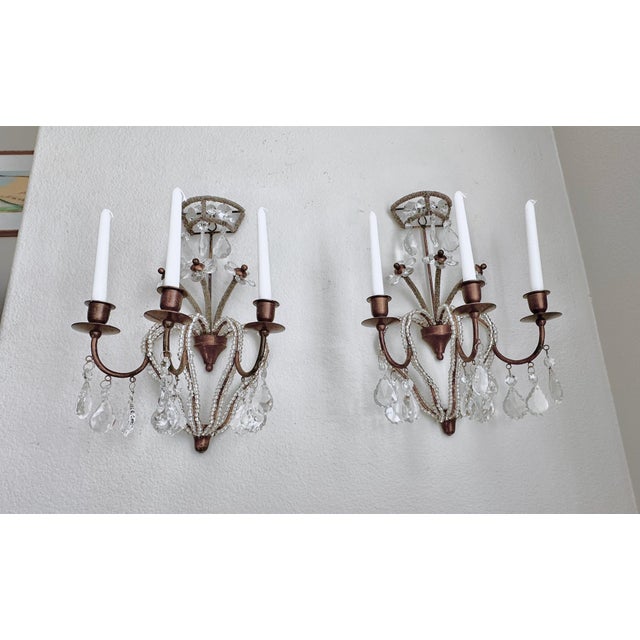 Pair of elegant Italian beaded and crystal prism candle only wall sconces, in the manner of Bagues. Frames are antiqued...