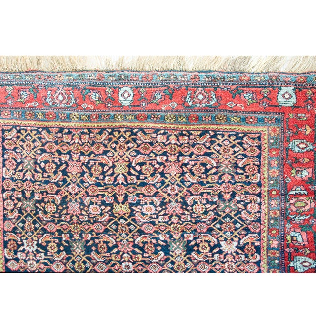 A remarkable early 20th century Persian Bidjar rug with an all-over trellis floral pattern woven with myriad stylized...