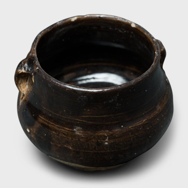 This petite glazed jar from China's Shanxi province exemplifies the timeless appeal of handcrafted pottery. Once used in...