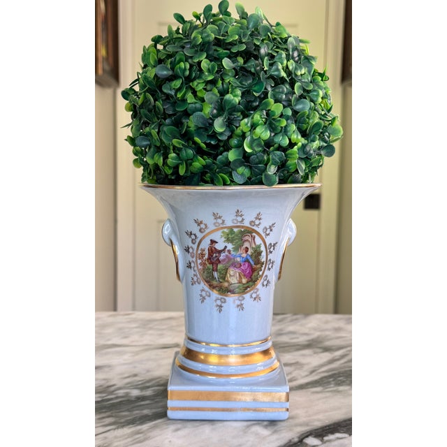 Here is a French blue vintage vase with central Fragonard motif scene featuring a couple in the garden. Plenty of gold...