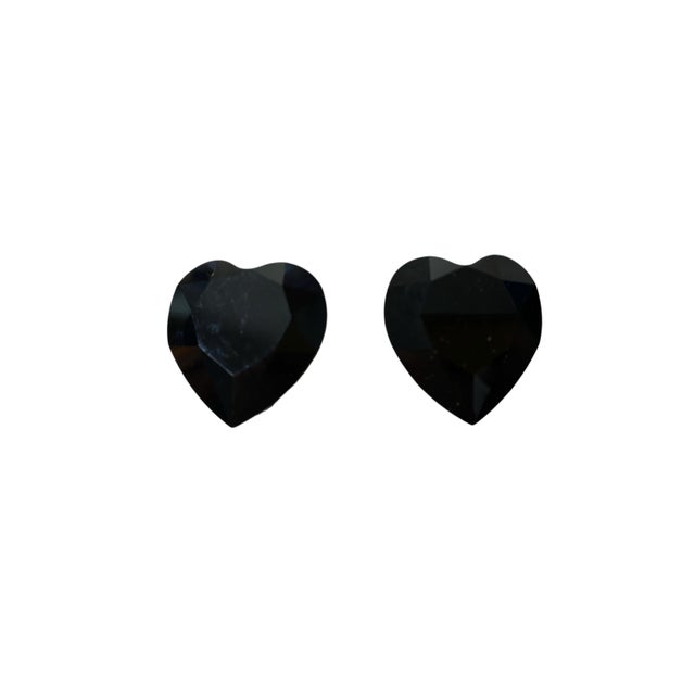 A striking pair of vintage clip-on earrings featuring faux black onyx stone shape heart silver tone clip -on . The...