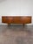 Beautifully refinished mid century modern teak credenza bar by Jentique United Kingdom. The right side has a usable down...
