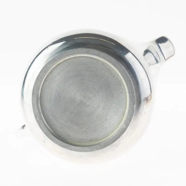 An elegant expression of period design, this Antique 1930’s Art Deco Picquot Silver Plated Coffee Cream Jug brings warmth...