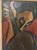 A Cubist-influenced oil painting depicting a figure playing a guitar, rendered in flattened, angular planes of red, blue,...