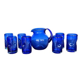 Vintage Spanish Revival Hand-Blown Seeded Cobalt Blue Pinched Dimple Glass Pitcher & Tumbler Set - 8 Pieces For Sale
