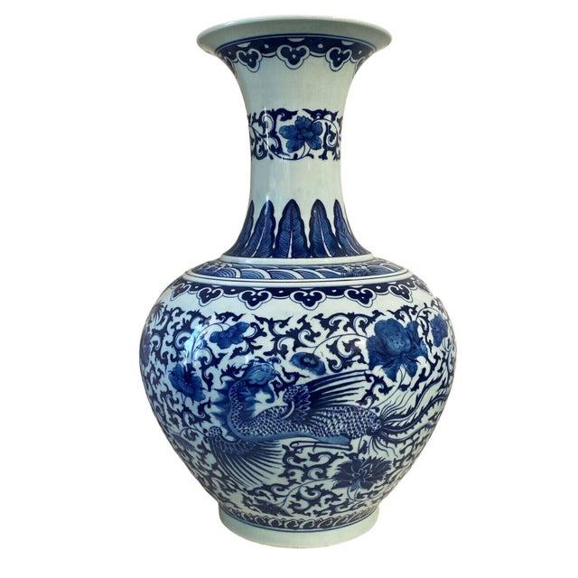 This exquisitely hand painted Chinoiserie porcelain vase boasts an elegant onion shape with a long neck, adorned with a...