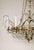 French Eight Armed Crystal and Brass Chandelier, Early 20th C. For Sale - Image 3 of 12