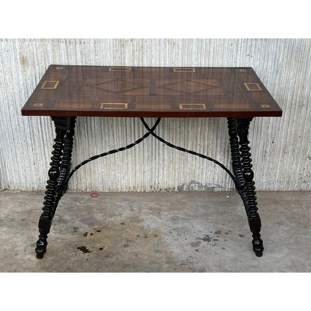 19th Century Baroque Spanish side table with marquetry top and iron stretcher 19th century Spanish trestle table in...