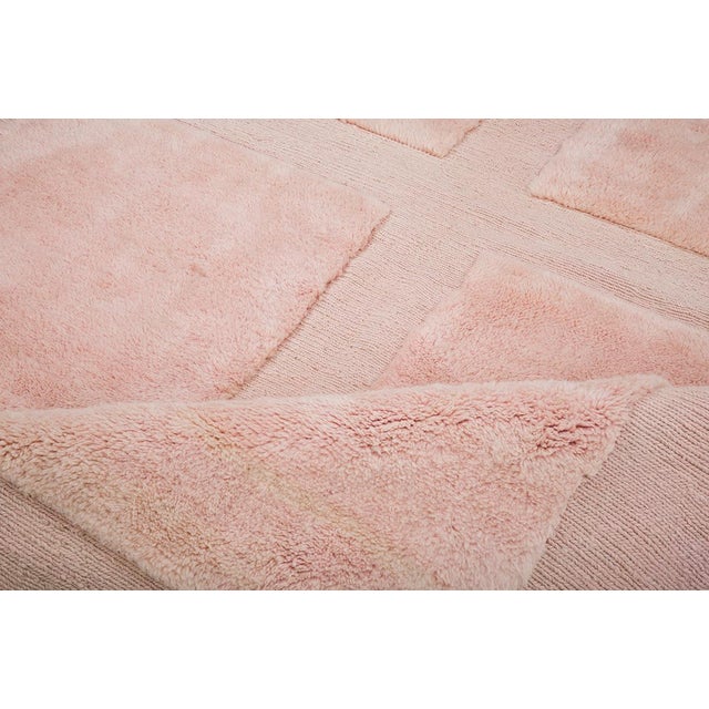 Elegant hand-knotted wool rug featuring soft Peach Pink rectangular panels, creating a serene and minimalist design. This...
