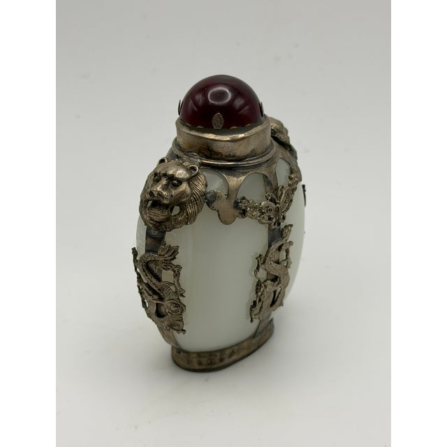 Opaline or milk glass snuff bottle can be recognized as the next best thing to a pure white nephrite bottle. There is...