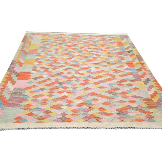 Hand-knotted with care using traditional rug-making techniques, this wool rug blends timeless craftsmanship with a modern...