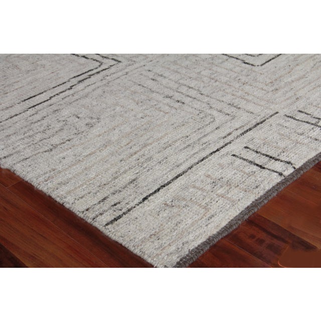 Anchor any room with the rich texture and pattern of the Adrian rug. Hand-knotted with a luxurious blend of wool and...