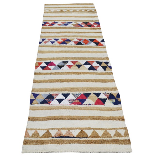 Hand-knotted with care using traditional rug-making techniques, this wool rug blends timeless craftsmanship with a modern...