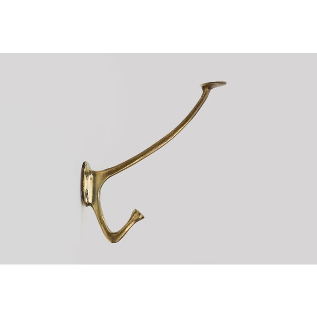 A rare and elegant set of four beautiful and elegantly curved Art Nouveau coat hooks by Adolf Loos, produced in Vienna...