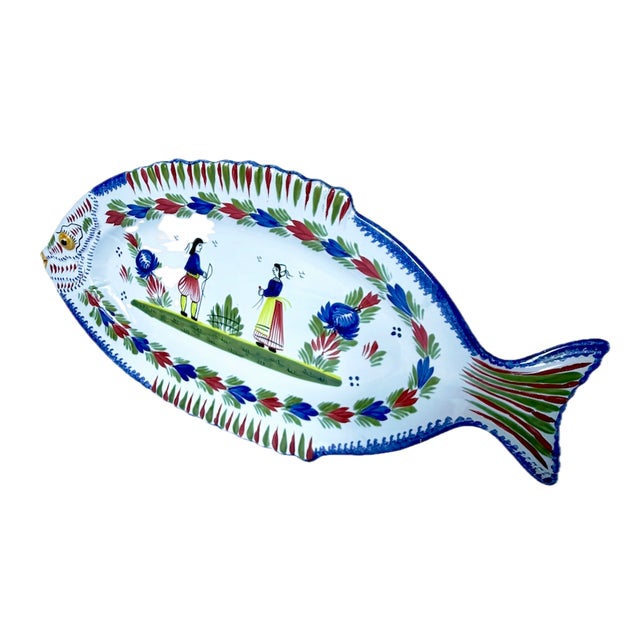 Vintage Henriot Quimper Fish Serving Platter. Depicts a handpainted hiker and maiden at the center of a fish shape serving...