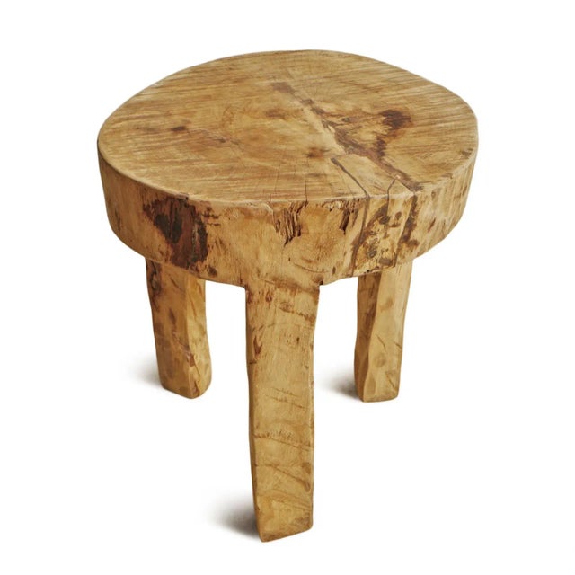 Rustic and beautiful hand ax chiseled raw wood table created from a solid hard wood trunk. Naga tribal indigenous accent...