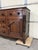 This is an early 19th-century English dresser base with timeless charm. The piece features six drawers, flanked by doors...