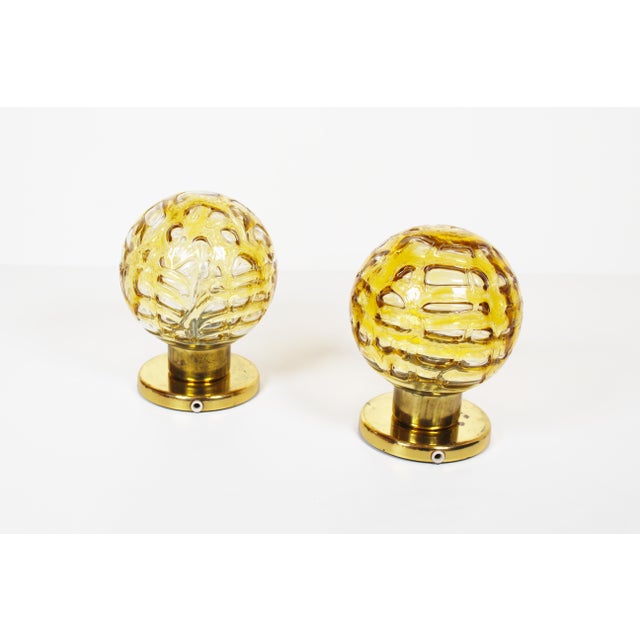 Beautiful and high-quality set of glass and brass wall lamps by Doria, Germany, 1970s. In good condition, no damage to the...