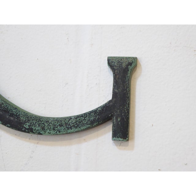 This bronze letter 'G' is from old signage.