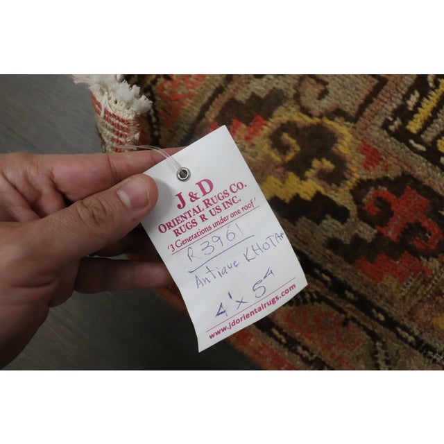 late 19th century east turkestan Khotan rug with cantaloupe colored ground. 4'1'' x 5'4''