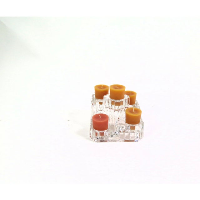 The candle holder has architectural tiered elements in its design and is made from heavy clear crystal glass. I found the...