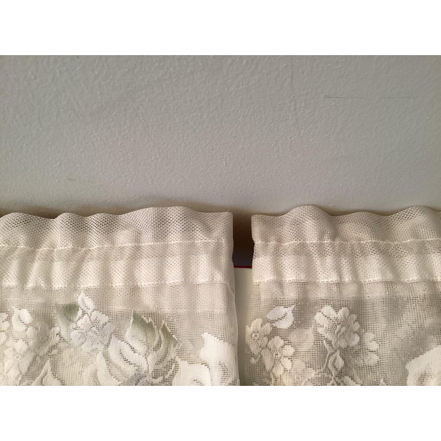 Four beautiful vintage lace valances with pink flowers and green leaves.