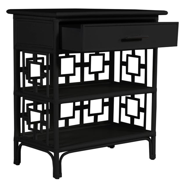 Classically styled, this end table features a Rattan frame with rawhide bindings. The intricate rattan detail is hand...