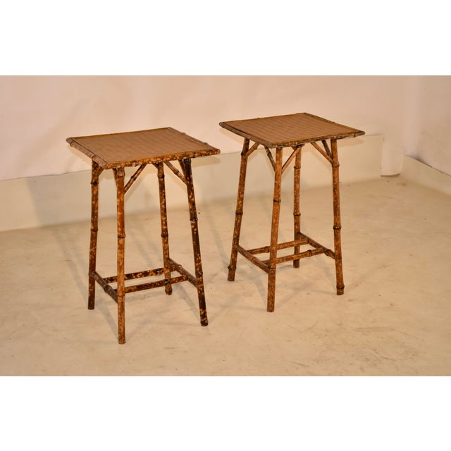 Pair of 19th century tortoise bamboo side tables from France. The tables have a basketweave pattern on the top, supported...