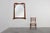 A graceful Art Nouveau wall mirror crafted in oak with gilded inlay, France, circa 1915. The frame’s flowing silhouette...