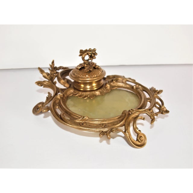 An antique 3-piece French brass or bronze desk set consisting of and inkwell and 2 candlesticks. All three pieces have...