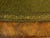 An English oval mahogany table from the 19th century, with green leather top, gilt and tooled arabesques, turned legs and...
