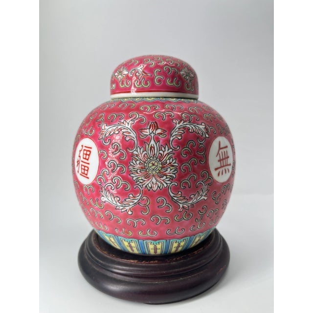 This is a vintage Japanese porcelain tea caddy, inspired by traditional Chinese tea storage vessels. The jar features a...