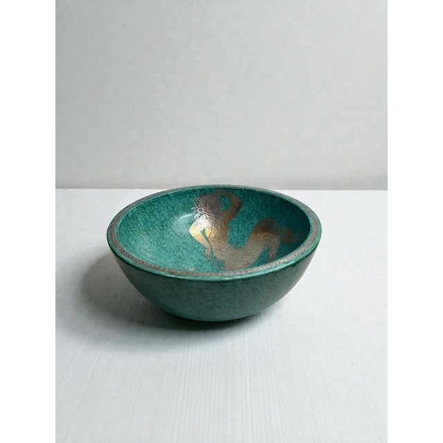 An exceptional argenta stoneware bowl designed by wilhelm kåge for gustavsberg, sweden, dated 1935. The bowl is executed...
