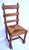 Imported from France. Set of six ladder-back chairs.. They are characterized by solid oak construction and traditional...