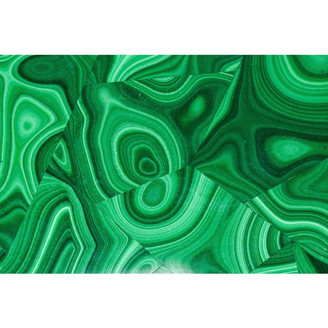 An exceptional example of luxury decorative arts, this early 20th-century malachite box is a striking statement of...