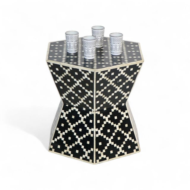 The Hexagonal bone Inlay table gets a contemporary twist with a bold geometric pattern and Black hue. Crafted of density...
