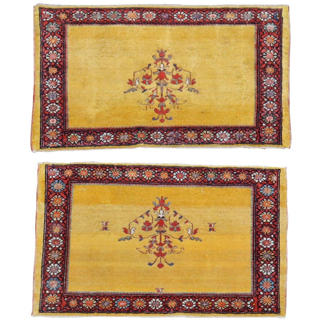 A whimsical pair of one of a kind Persian Ferehan rugs with a bright yellow Measuring 19" x 31" respectively.