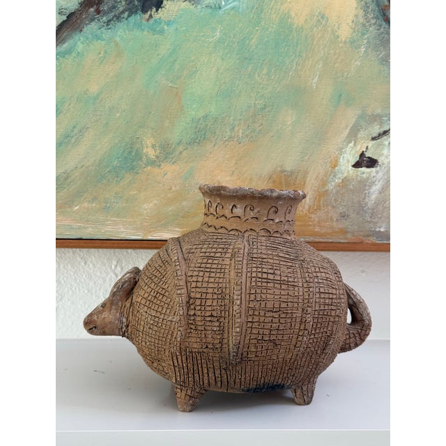 A striking, hand-crafted studio art pottery vessel shaped like an armadillo. Heavily inspired by ancient Pre-Columbian...