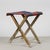 This vintage folding stool, ideal for the beach or camping, evokes a simple and functional aesthetic typical of years gone...