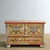 This vintage pine chest with a drawer from the mid-20th century is a real eye-catcher. It is richly decorated with hand-...