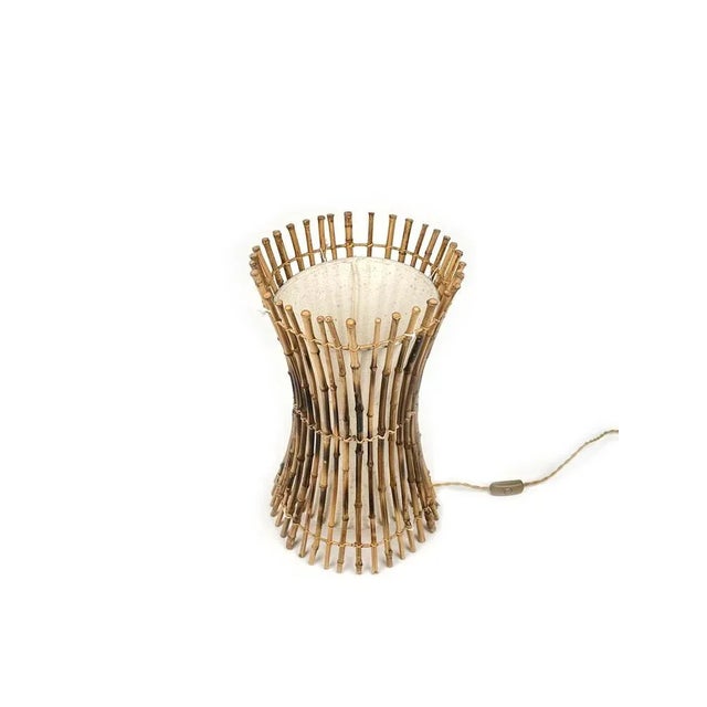 Amazing table or floor lamp in bamboo, rattan and cotton in the style of the Italian design Franco Albini. The structure...