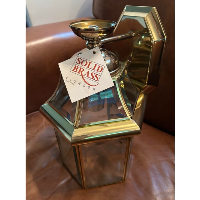 Brand new, no box solid brass Kichler outdoor lantern. Beveled glass. 15 1/2" high x 7" wide. Extends 8" from the wall....