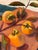 This oil painting on linen was done en plein aire (in the open air, onsite) in Tuscany where the persimmons were picked...