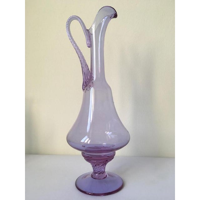 This is an elegant shaped bottle hand made in Murano, Venice in 1960 in Murano blown glass. The piece is very charming and...
