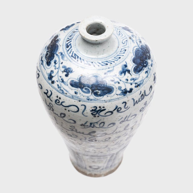 This elegant, blue-and-white vase from the early 20th century honors the long history of cultural exchange between...