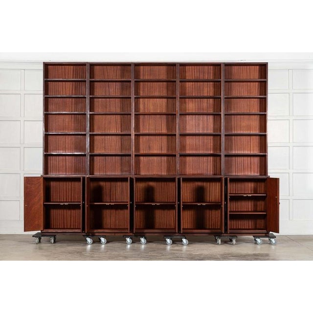 Circa 1960 Monumental Mid Century Modern Mahogany Sectional Bookcase Provenance: Estate of Author Storm Jameson Together...